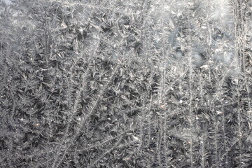 Fototapeta premium Beautiful winter background with frosty pattern on glass
