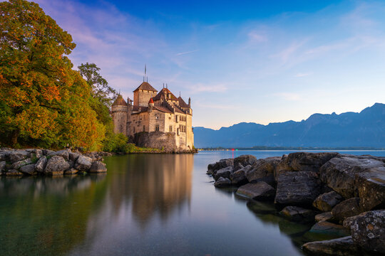 MONTREUX, SWITZERLAND - OCTOBER 6, 2024: Chillon Castle in autumn on Lake Geneva. The castle has a history dating back until at least the 12th century.