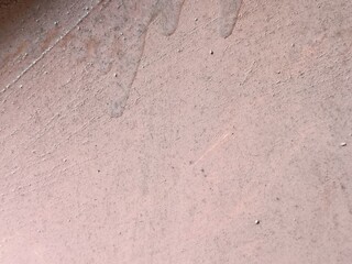 Macro Texture of Weathered Pink Metal Surface - Detailed Background of Rusted Oxidized Iron with Gritty Peeling Paint and Industrial Corrosion