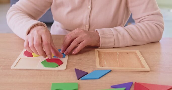 Senior old elderly female deduction to solve logic game, playing for developing memory, learning to plan strategy, anti dementia, brain disorder, causing thinking ability, cognitive decline symptoms