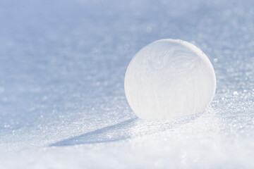 Frozen Soap Bubble Resting on Ice