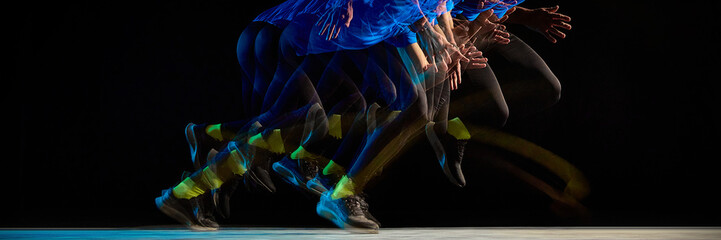 Obraz premium Stroboscopic runner motion with layered movement on dark background. Concept of speed, acceleration, dynamic energy, athletic performance, time sequence, and human motion visualization. Banner