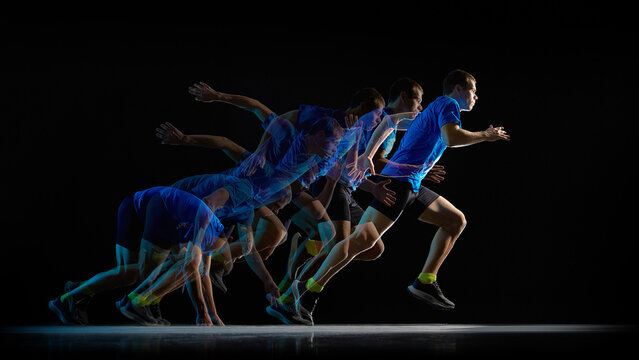 Stroboscopic sprint start sequence of male runner on black background. Concept of explosive acceleration, reaction speed, power training, athletic performance, and professional sports preparation.