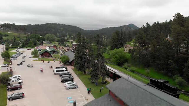 HILL CITY, SD - JULY 2019: Aerial view of city train station. The train connects  the city with Keystone. Slow motion