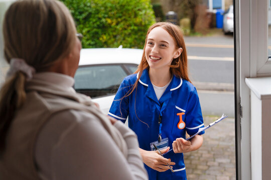 Nurse visiting a home to provide medical care and support at a residential area during the day