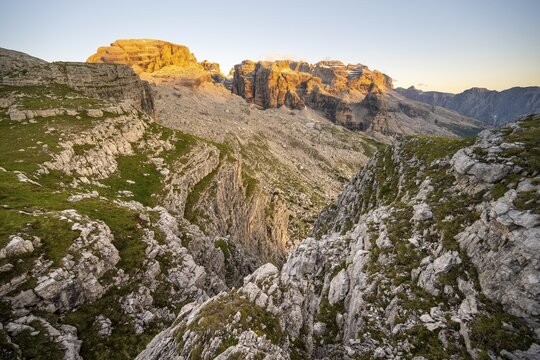 View of rocky mountain peaks of the Brenta Mountains at sunset, Alpengl&uuml;hen, mountain landscape on the Grost&eacute; Plateau, Brenta, Parco Naturale Brenta-Adamello, Trentino, Italy