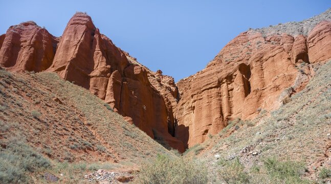 Rock formations of eroded red sandstone, near Konorchek Canyon, Chuy, Kyrgyzstan