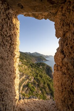 View from embrasure at Torre des Verger, stone tower on the coast, sea view, Banyalbufar, Majorca, Balearic Islands, Spain