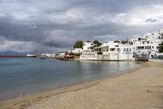 Paralia Choras Mikonou beach, white Cycladic houses of Mykonos town, Mykonos, Cyclades, Greece