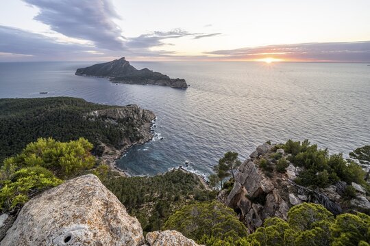 View of mountains and coast with sea, at sunset, walking to La Trapa from Sant Elm, back island of Sa Dragonera, Serra de Tramuntana, Majorca, Spain