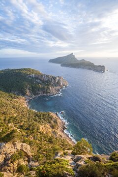 View of mountains and coast with sea, in the evening light, hiking to La Trapa from Sant Elm, at the back island Sa Dragonera, Serra de Tramuntana, Majorca, Spain
