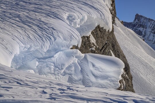 Structured snow cornices in an ice and snow landscape, Gemmi, Valais, Switzerland
