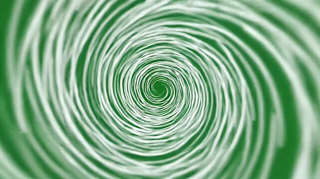 White, blurred spiral pattern on a green background. It appears to swirl inwards towards a central point
