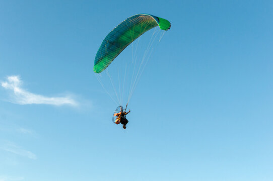 paragliding in the blue sky