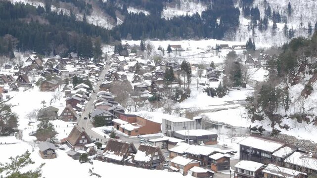 aerial landscape view of shirakawago village among mountain hill range with many gassho zukuri traditional house japanese style with snow covered. Shirakawago village in winter snowy time