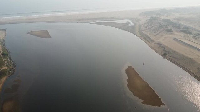 aerial top view drone video clip of scenic wave formation in a sea beach of famous travel destination city Puri in India

