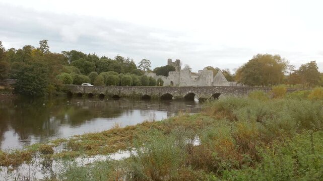 Desmond Castle on the River Maigue in Adare, County LImerick, Ireland on a gloomy day.