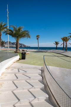 stairs curve coastal palm ocean promenade architecture modern sunlight travel along waterfront path with clean lines and summer vacation background