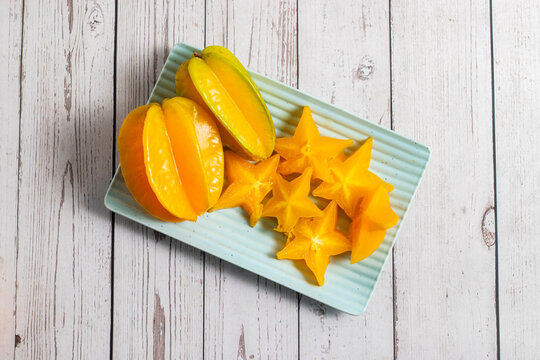 Star fruit is a tropical, juicy fruit with crisp texture, sweet tart flavor, and distinctive star shaped slices when cut.
