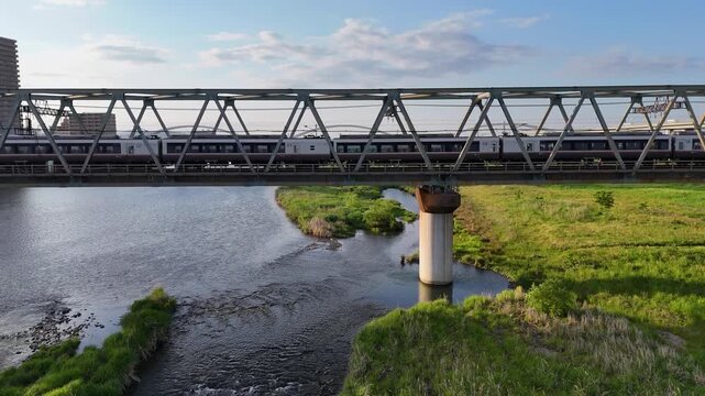 Odakyu Romancecar train on a bridge aerial landscape of Japanese railway.