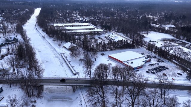 Outdoor public park in Winter time after deep snow fall from freezing cold front in central New York State village of Fairport