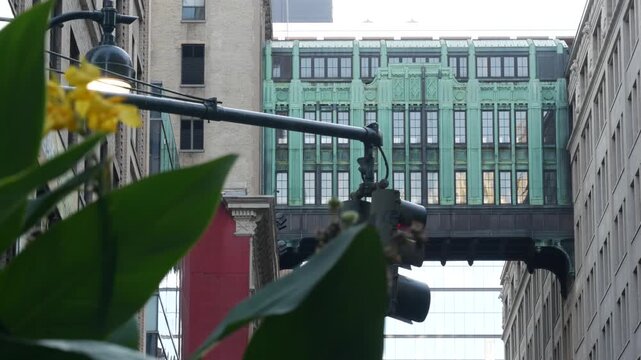 New York City Gimbels bridge, Manhattan Midtown, United States of America. Skybridge on Broadway, Herald Square, USA. Gimbels traverse on 6 avenue. Historic elevated walkway 1925, copper green patina.