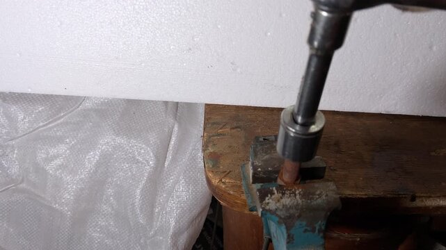 Use a ratchet wrench to loosen the nut on the bolt