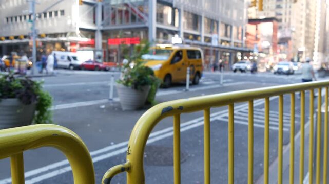 Manhattan Midtown street New York City, United States of America. Port authority bus terminal. Defocused car traffic on urban road, 8th avenue in Hells Kitchen. People pedestrian, yellow taxi cab.