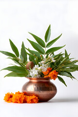 Copper kalash pot with leaves, coconut, and flowers for Gudi Padwa festival. Divine and traditional Indian new year celebration.