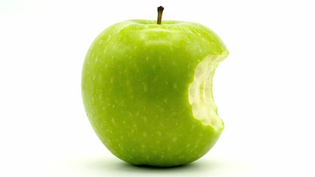 Green apple with bite on clean white background