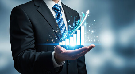 Businessman holding a glowing graph in his hand, symbolizing growth and success in a corporate setting