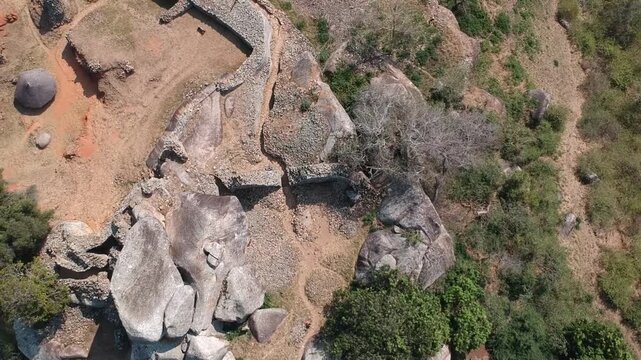 Close-up of the dry-stone masonry and mortarless granite walls at the Great Zimbabwe National Monument. The mysterious Conical Tower inside the Great Enclosure of the Great Zimbabwe ruins, Masvingo