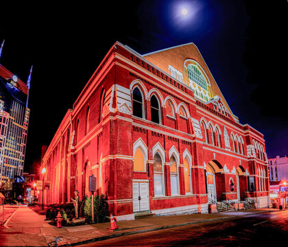Nashville, Tennessee&mdash;Mar 15 2019; Ryman Auditorium illuminated at night under a bright moon, showcasing the iconic red-brick fa&ccedil;ade of the historic music venue