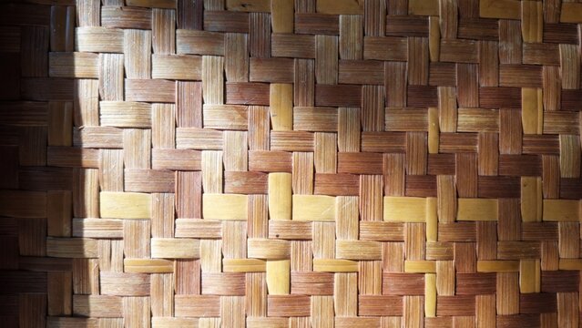 texture of woven bamboo that has been varnished with clear paint.