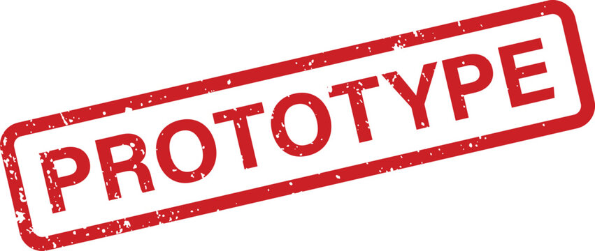 A distinctive red rubber stamp displaying the word PROTOTYPE inside a rectangular border on a pristine white surface