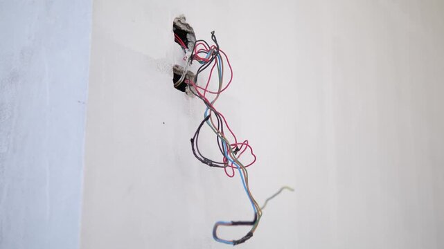 Exposed Electrical Wires in Unfinished Wall During Building Construction