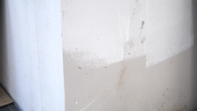 Unfinished Painted Wall with Visible Patch Marks