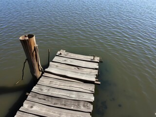 A weathered, old wooden dock in disrepair, partially submerged in a murky lake,  old,  atmospheric