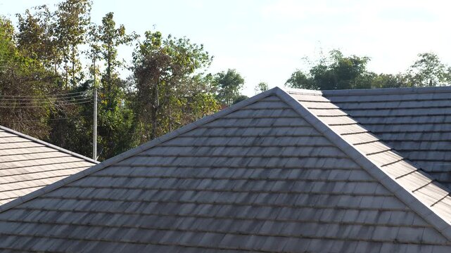 Residential House Roof with Gray Roof Tiles Under Clear Sky, Modern Housing Architecture