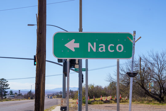 Sign giving directions to the border town of Naco, Arizona