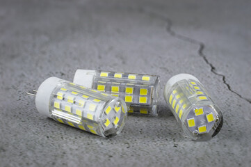 a led light bulb on a concrete background.