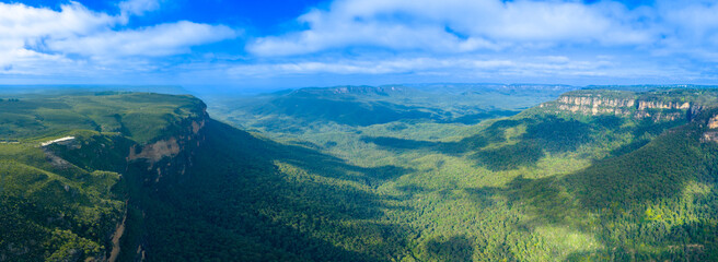 Drone aerial panoramic photograph of the Jamison Valley near the town of Wentworth Falls in the Blue Mountains in New South Wales, Australia.