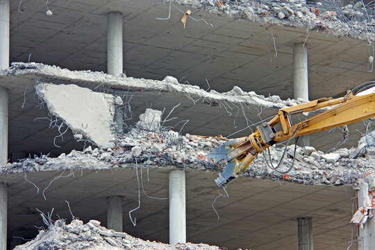 Demolition of the building with demolition excavator