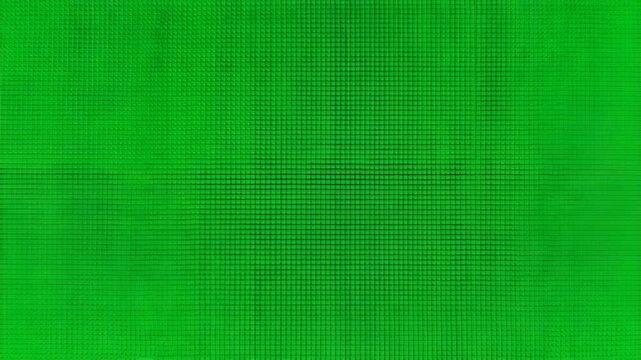 A vibrant green screen display with slight pixelation and a darker frame edge