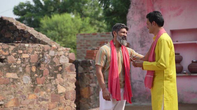 indian farmer giving money to his friend