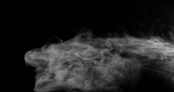 Super Slow Motion of White Surface Smoke Texture Isolated on Black Background. Filmed on High Speed Cinema Camera, 500fps. VFX element for overlay.
