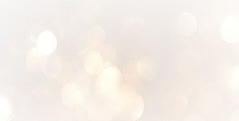 Golden bokeh glitter with sparkling stardust particles and glowing light forming magical abstract festive background for holiday, fantasy party, card illustration and vector design.  © ALLA