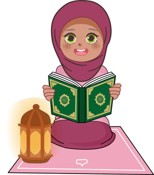 A young Muslim girl in a hijab reads a holy book next to a lantern.