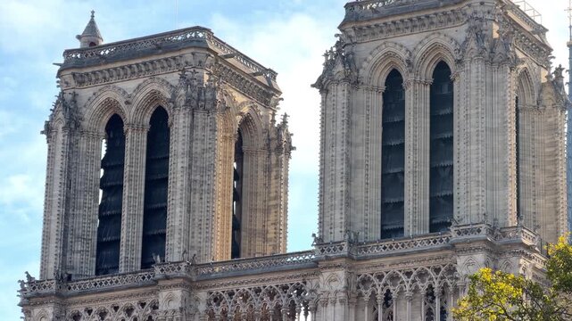 The newly restored towers of Notre-Dame de Paris with a blue sky in Paris, France