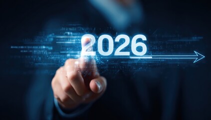 Finger touches glowing digital year 2026 with forward arrow.